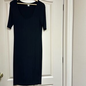 Bar III black form fitting knit dress with scoop neck.